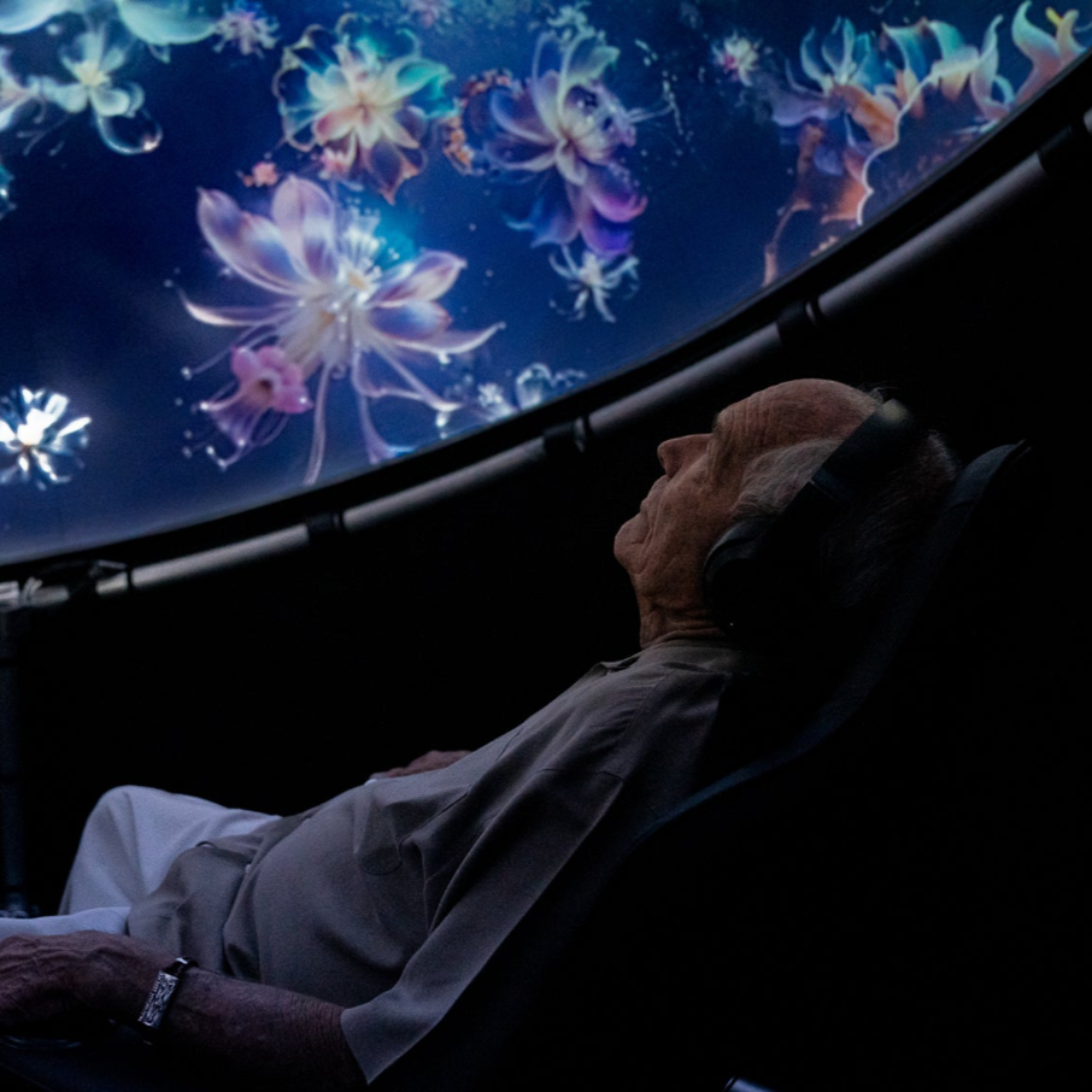 Man sitting in a Setl immersive projection dome