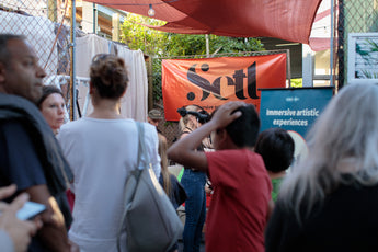 People standing in line waiting to try Setl immersive artistic experience using virtual reality